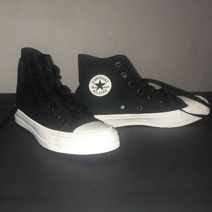 Black high-top Chuck Taylor Converse All-Stars